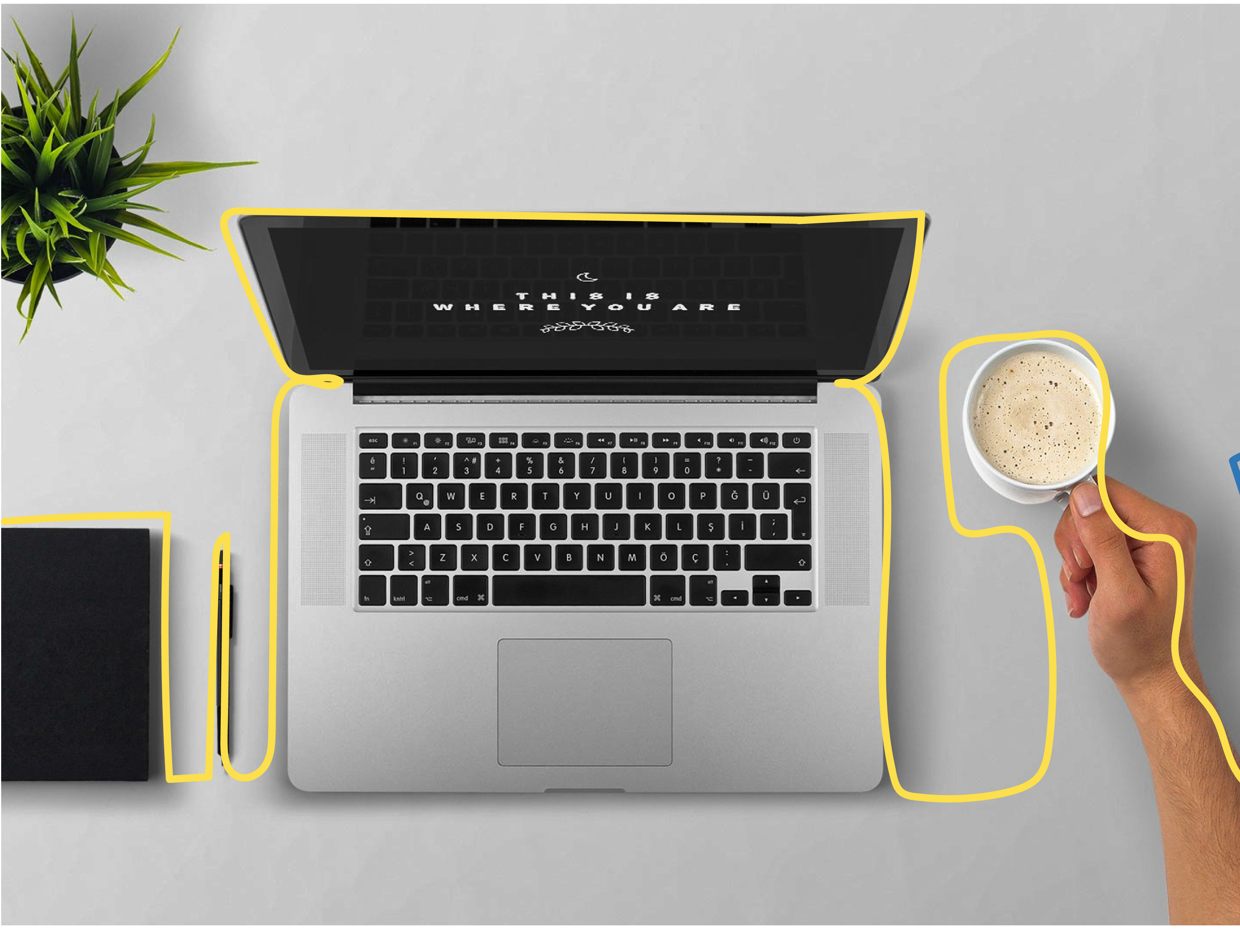 Laptop with notebook and coffee cup